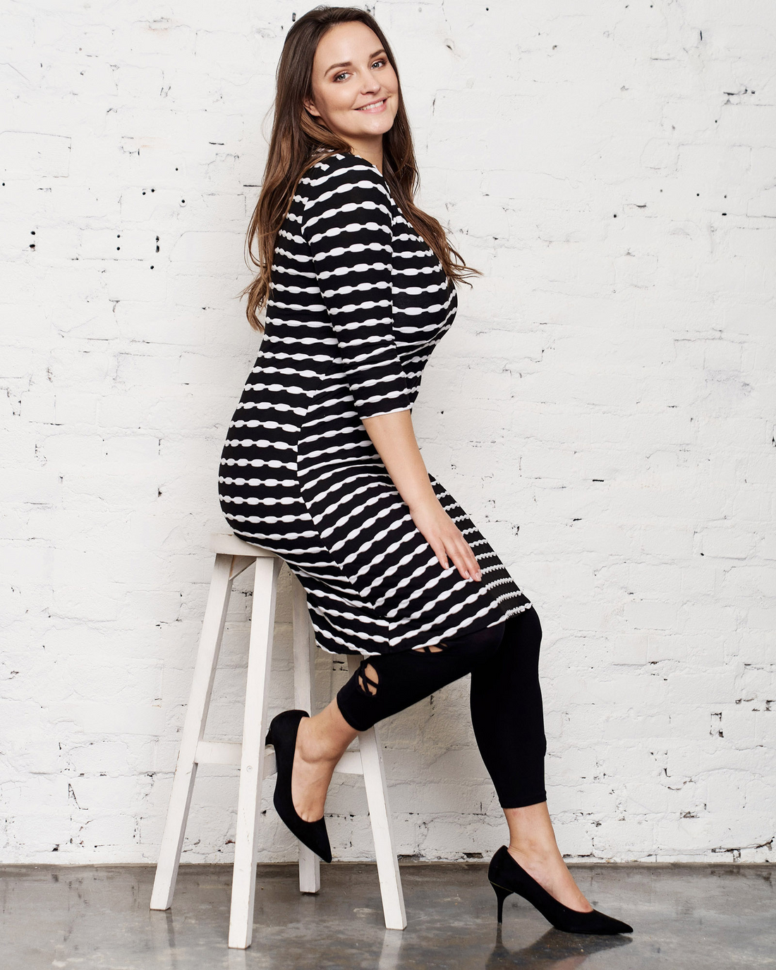 plus size woman on stool